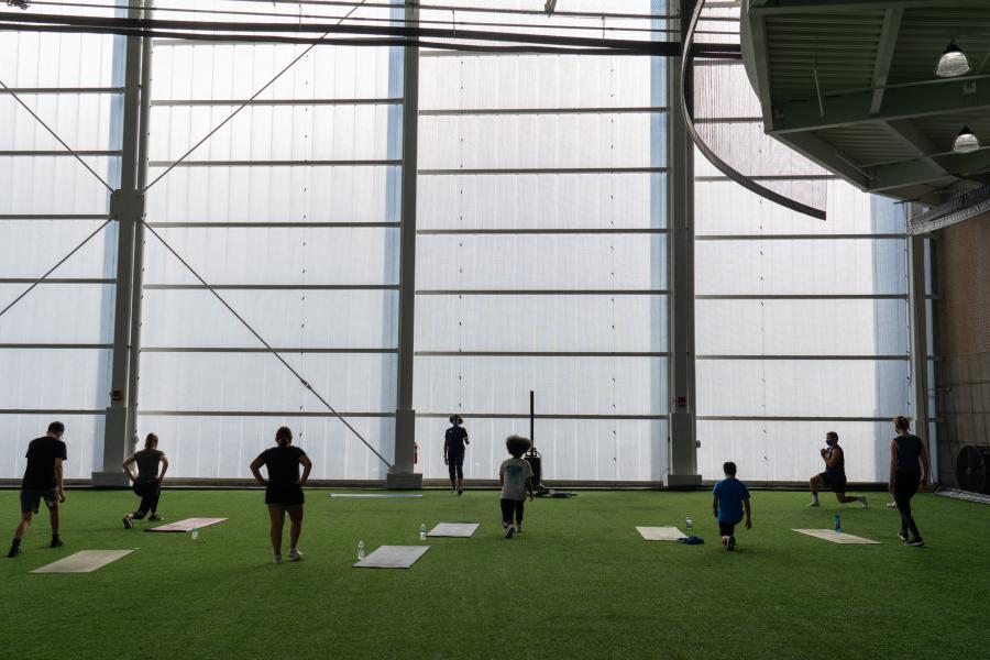 Students taking a workout class for academic credit in the Fieldhouse of the Powerhouse.